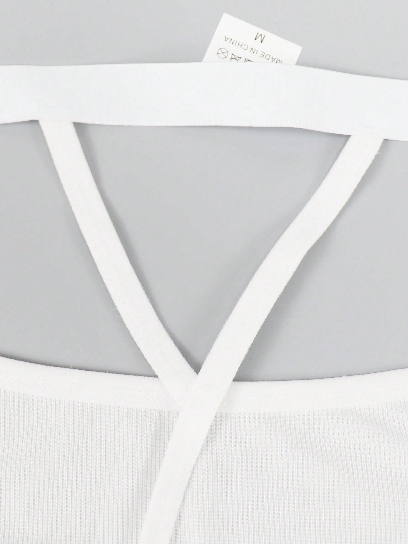 Men's low-rise thong underwear with plain cut-out design in medium-stretch knitted fabric.