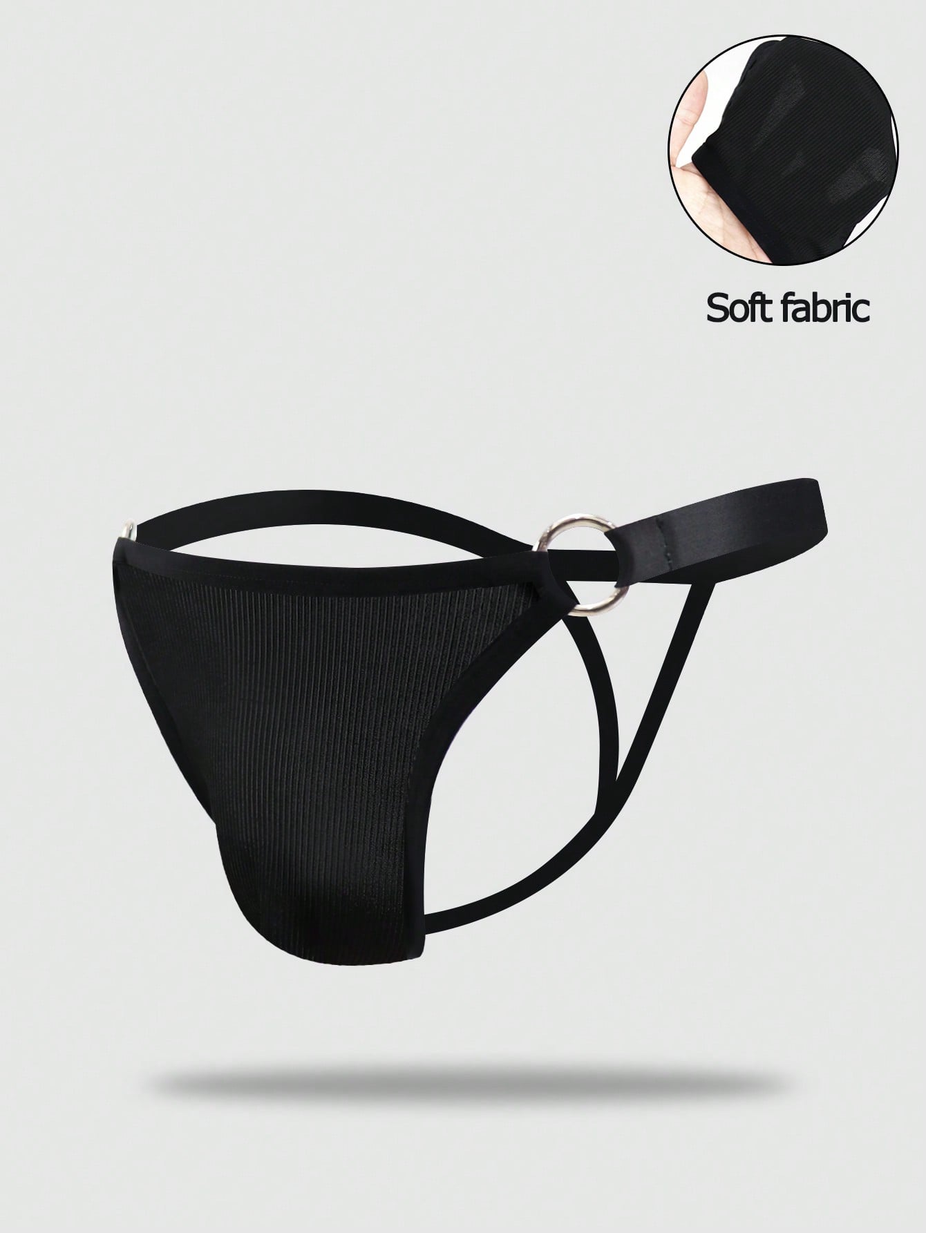 Men's low-rise thong underwear with plain cut-out design in medium-stretch knitted fabric.