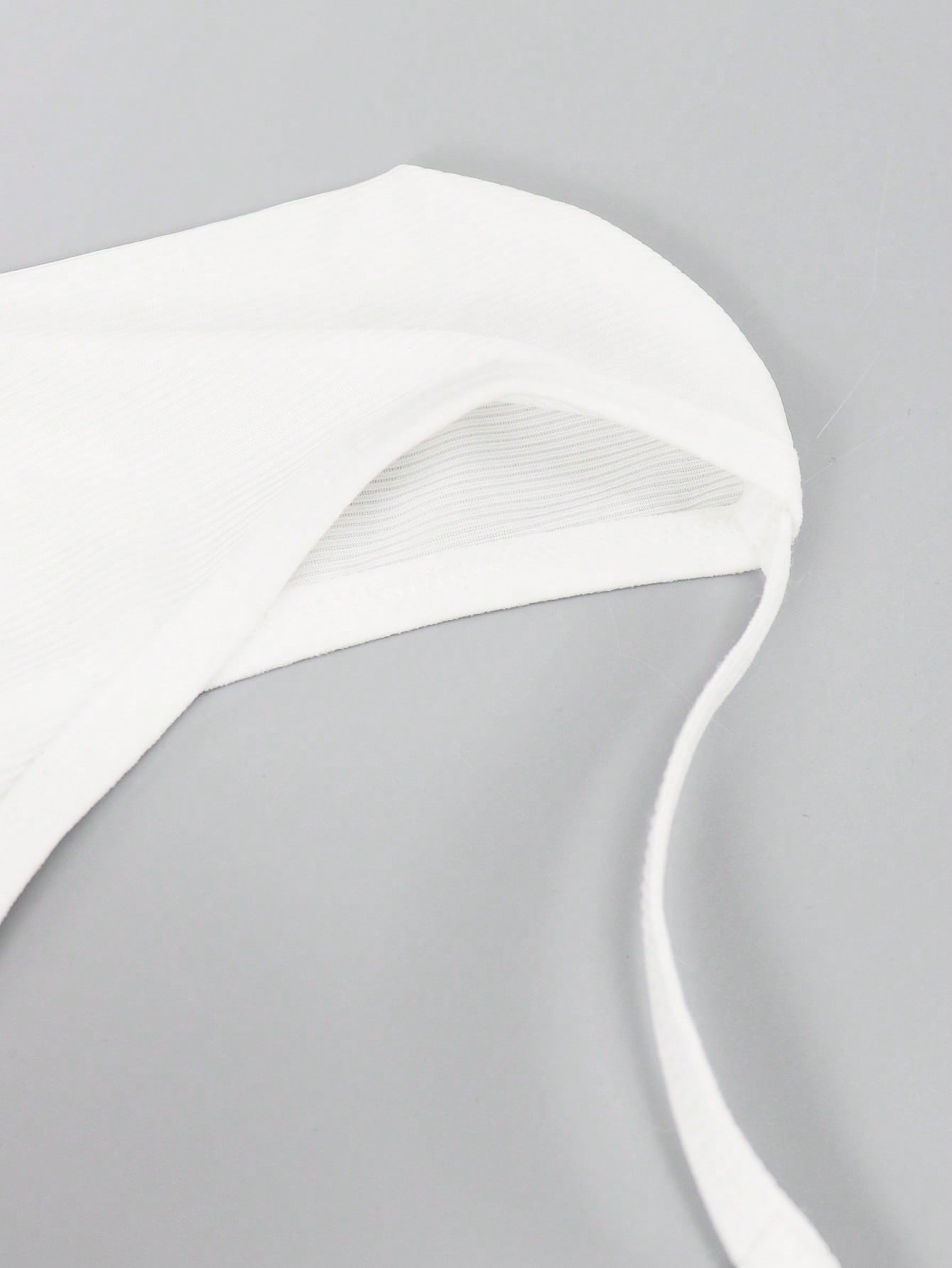 Men's low-rise thong underwear with plain cut-out design in medium-stretch knitted fabric.