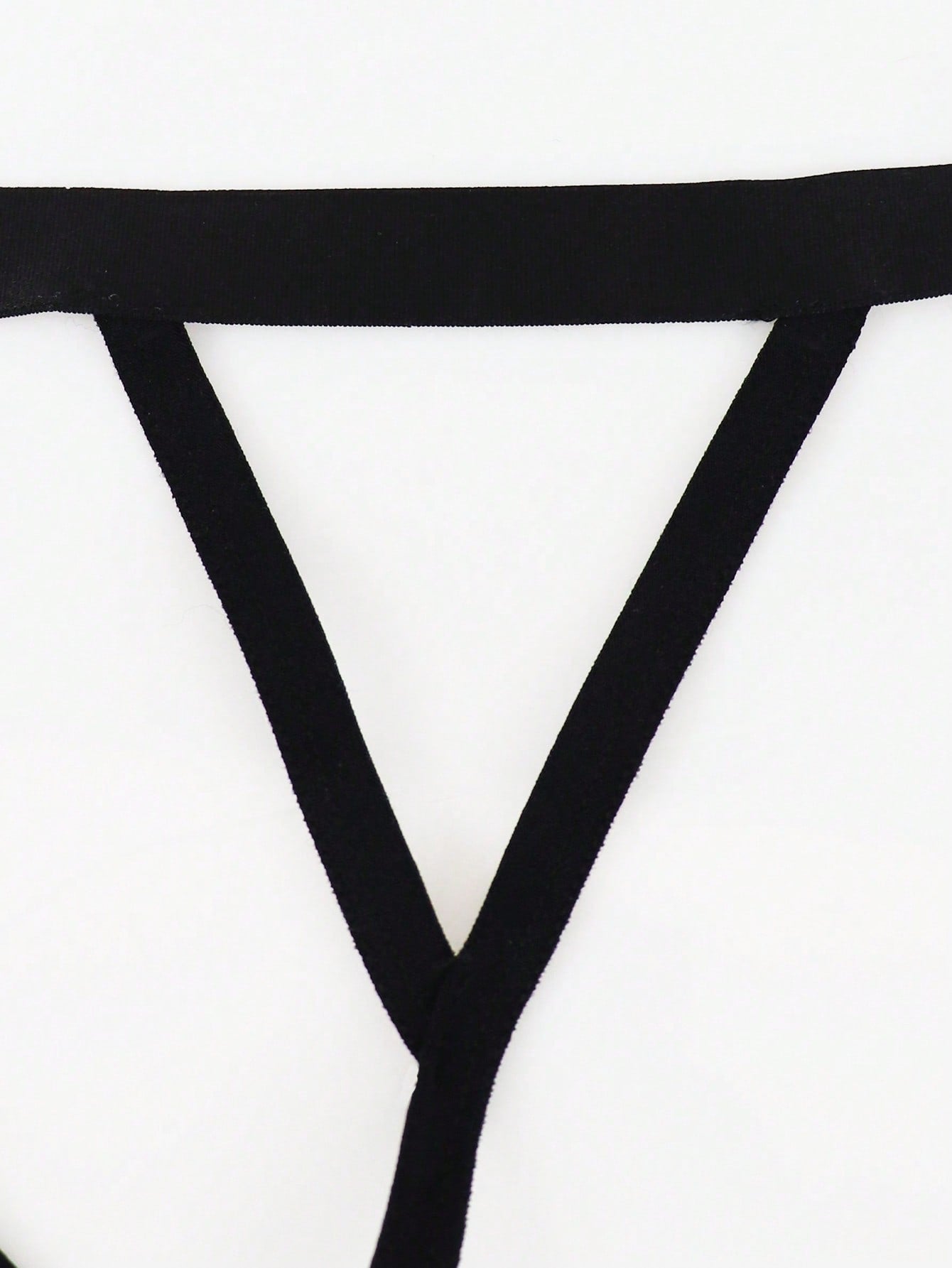 Men's low-rise thong underwear with plain cut-out design in medium-stretch knitted fabric.