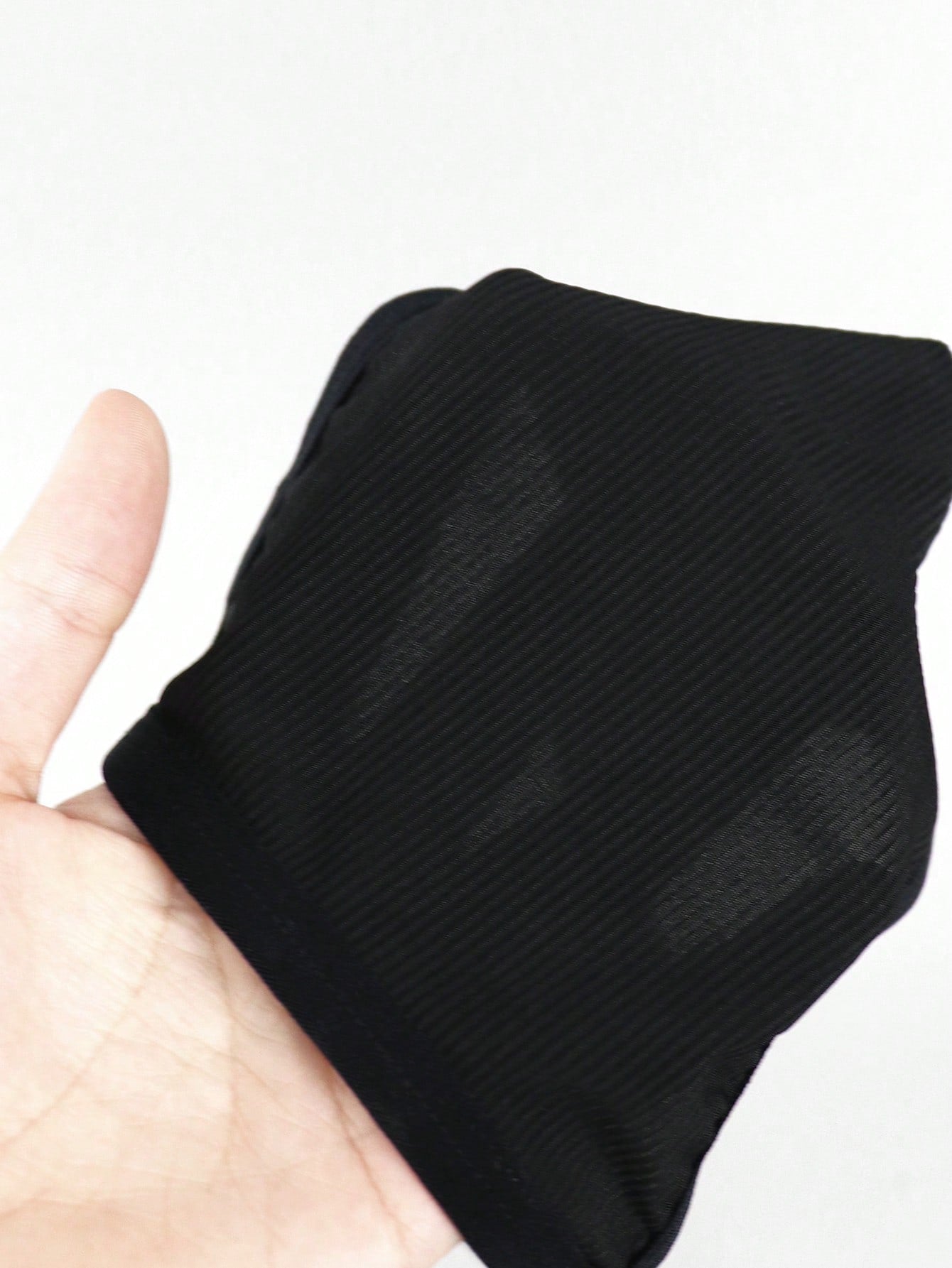 Men's low-rise thong underwear with plain cut-out design in medium-stretch knitted fabric.