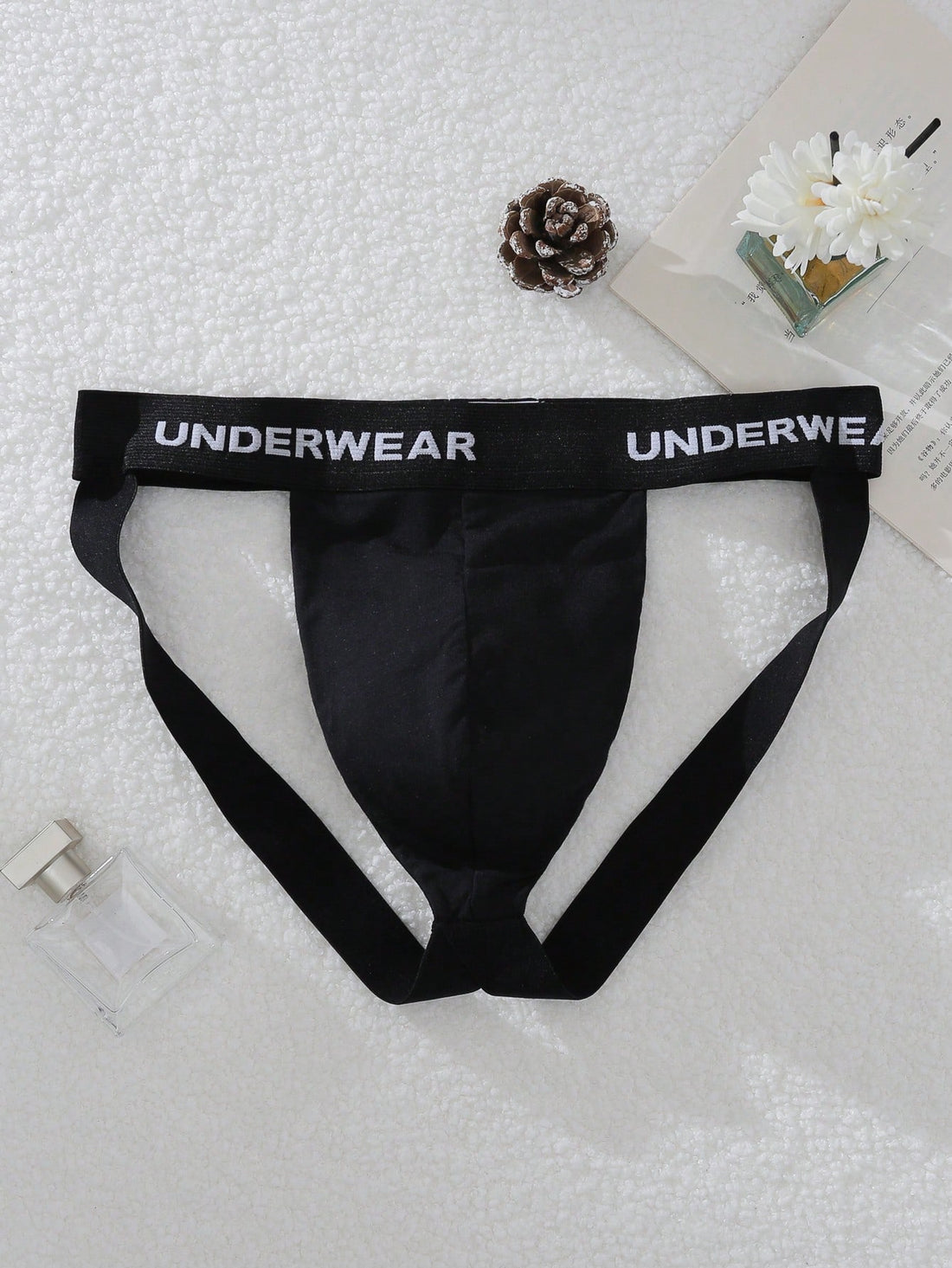 Men's multicolor low-rise G-string jockstrap with letter printed waistband, cut-out detail, and sporty tape accents
