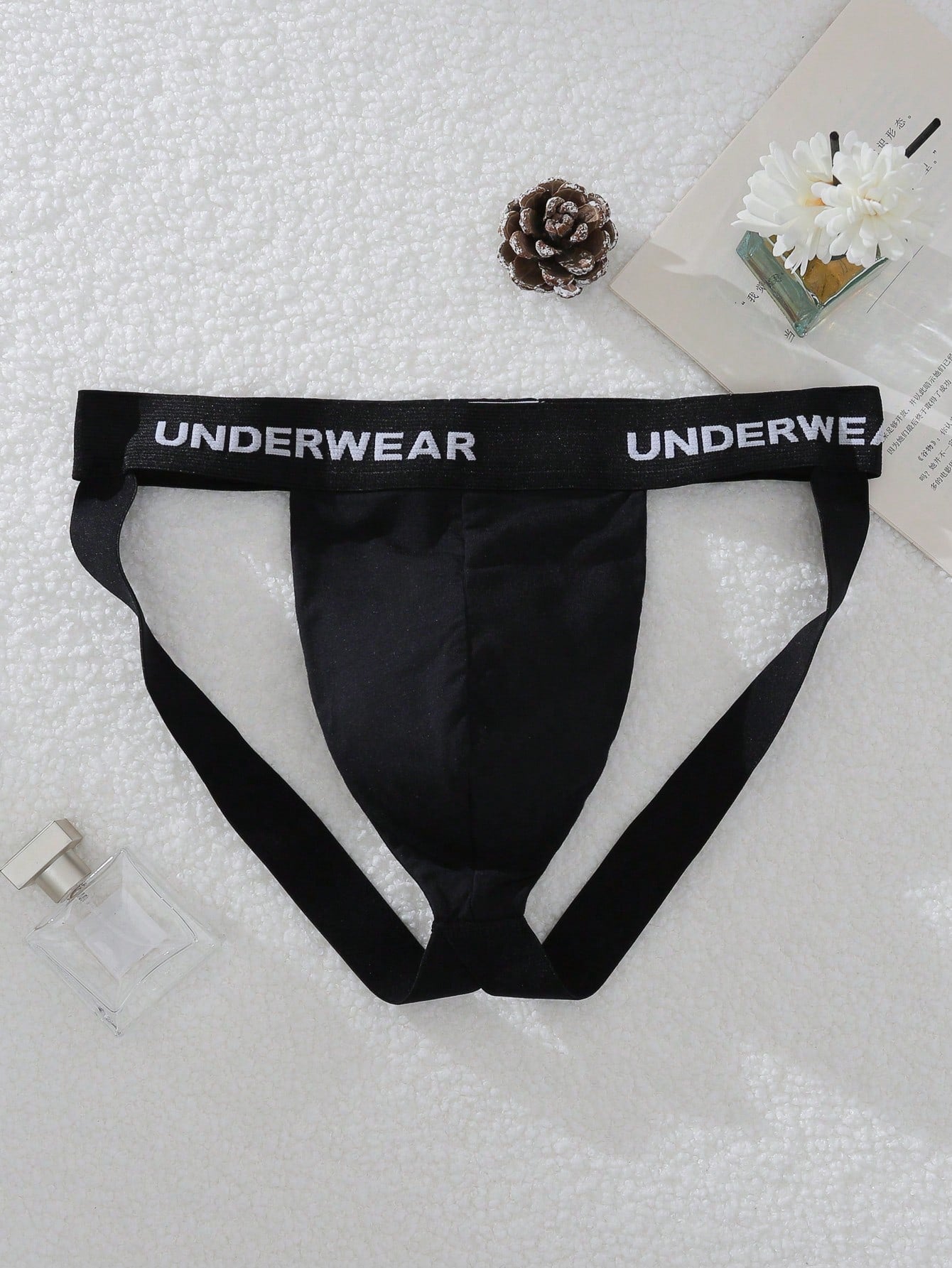 Men's multicolor low-rise G-string jockstrap with letter printed waistband, cut-out detail, and sporty tape accents