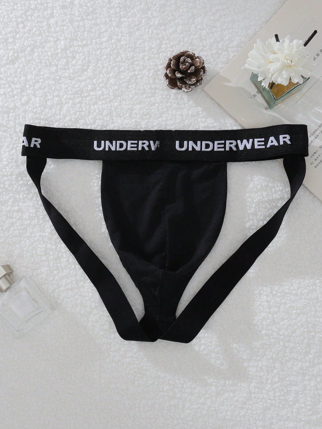 Men's multicolor low-rise G-string jockstrap with letter printed waistband, cut-out detail, and sporty tape accents