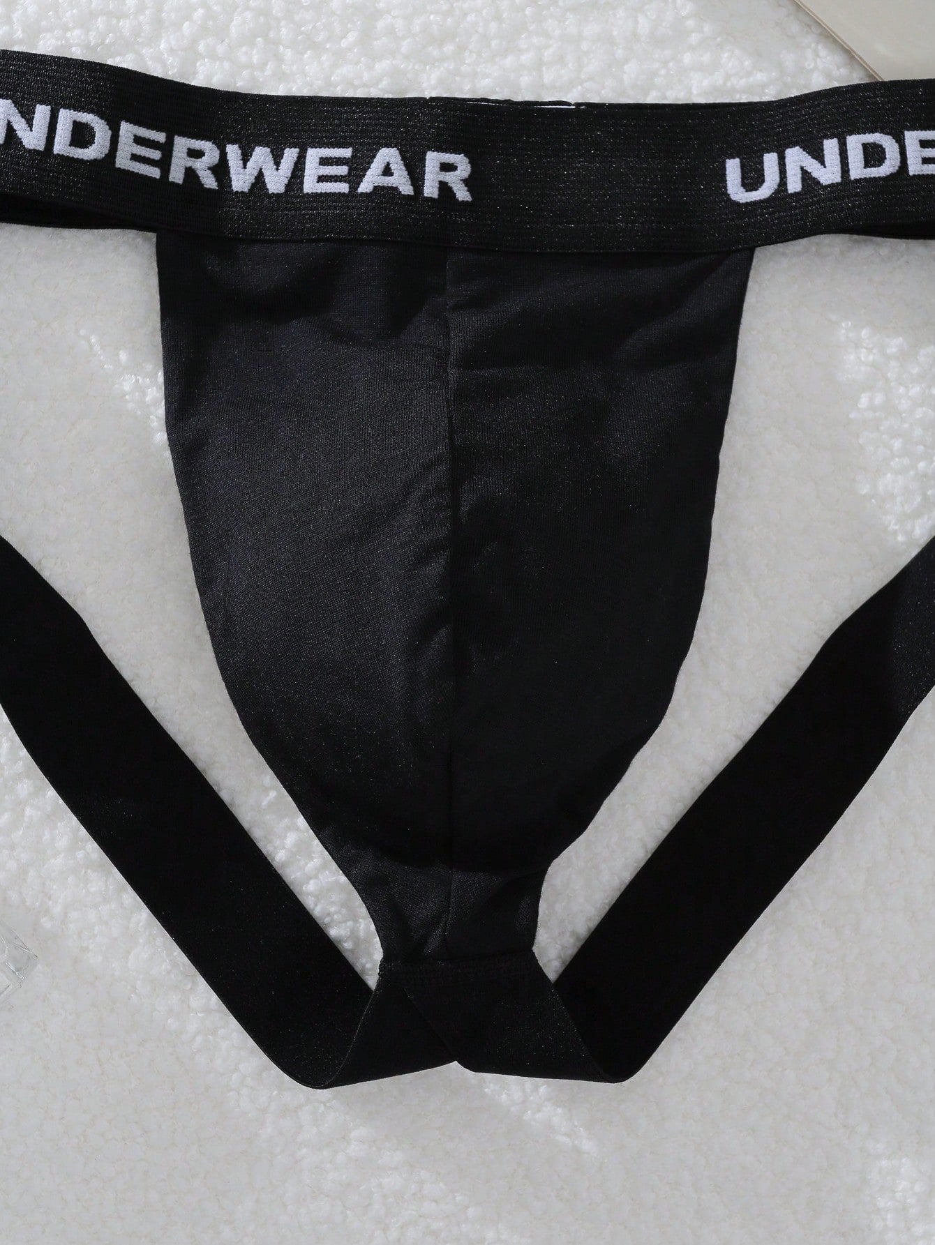 Men's multicolor low-rise G-string jockstrap with letter printed waistband, cut-out detail, and sporty tape accents