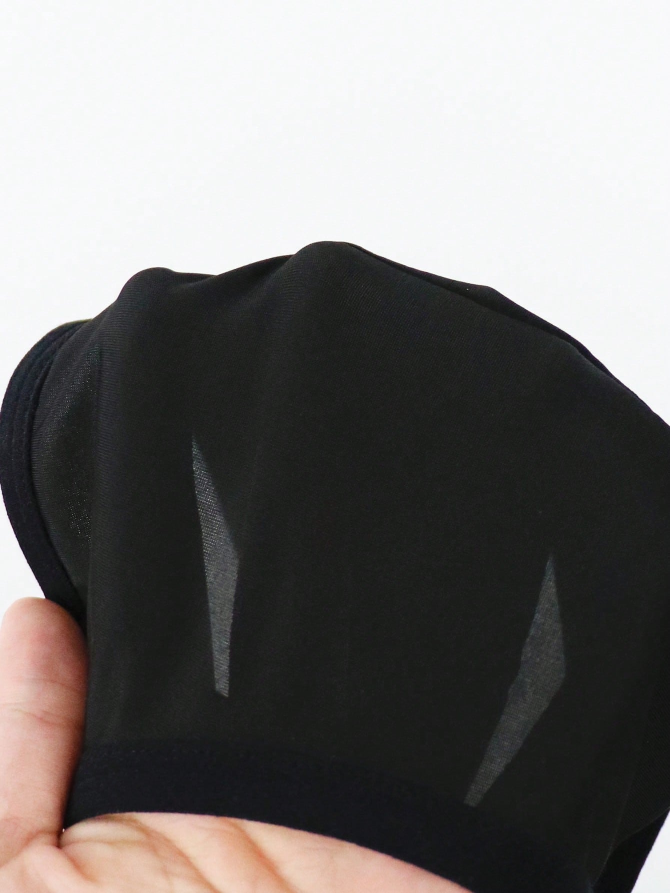 Men's solid color hollow breathable jockstrap underwear with a low-rise brief-style front and minimalist design