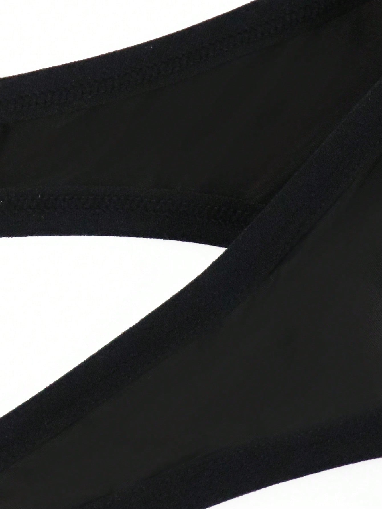 Men's solid color hollow breathable jockstrap underwear with a low-rise brief-style front and minimalist design