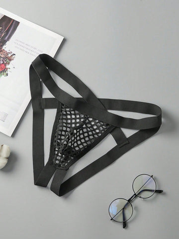 Men's black semi-sheer mesh double thong jockstrap with criss cross straps, cut out details, low rise fit, and geometric pattern.