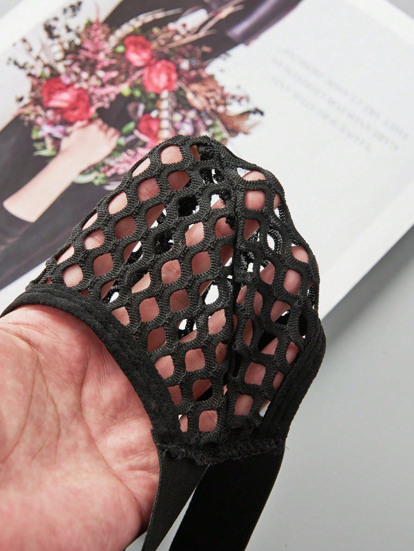 Men's black semi-sheer mesh double thong jockstrap with criss cross straps, cut out details, low rise fit, and geometric pattern.