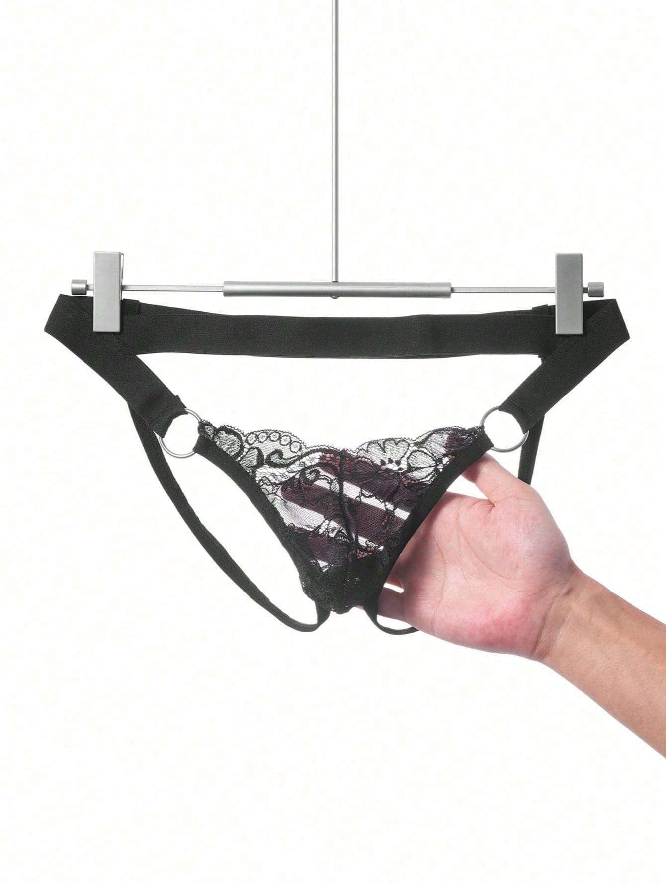 Men's black lace low-rise jockstrap thong with contrast lace, hollow-out details, and semi-sheer plain design