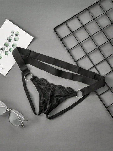 Men's black lace low-rise jockstrap thong with contrast lace, hollow-out details, and semi-sheer plain design