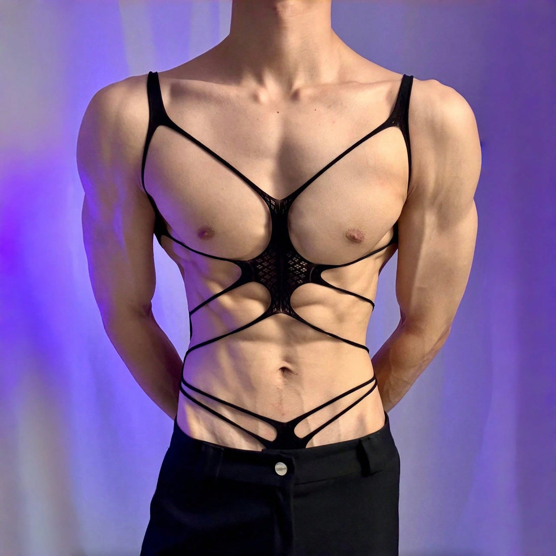 Men's black semi-sheer cut-out bodysuit lingerie with hollow-out design, low-rise fit, short length, and fake print pattern.