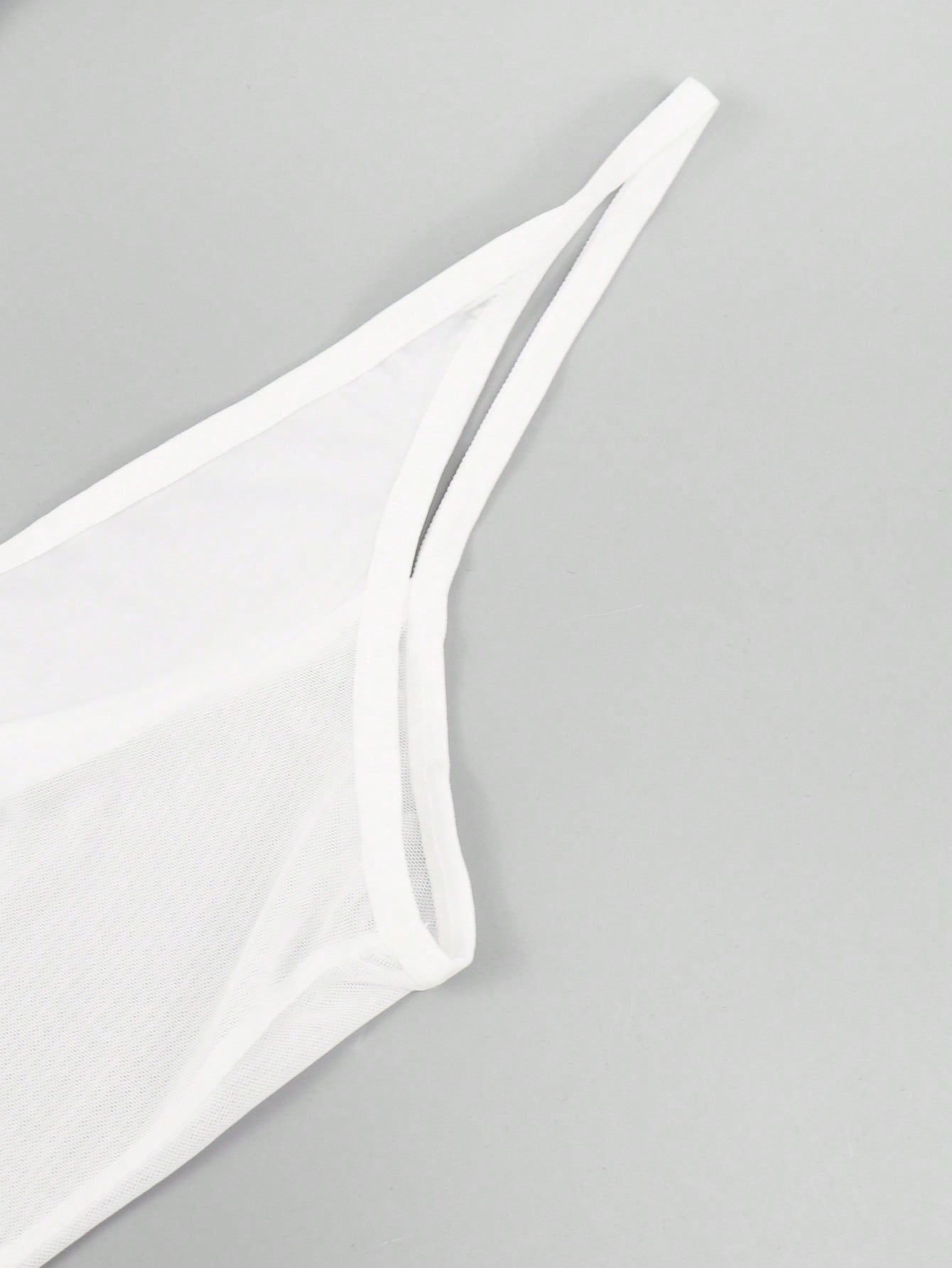 Men's white mesh thong underwear with deep V-neck, cut-out detail, plain design, and mid-rise fit.
