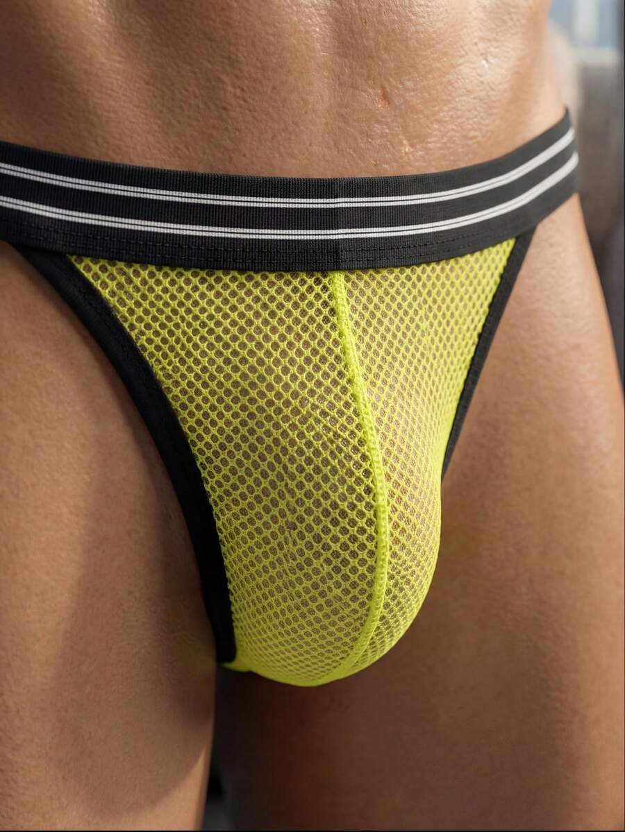 Men's low rise mesh jockstraps featuring contrast mesh cut out details.