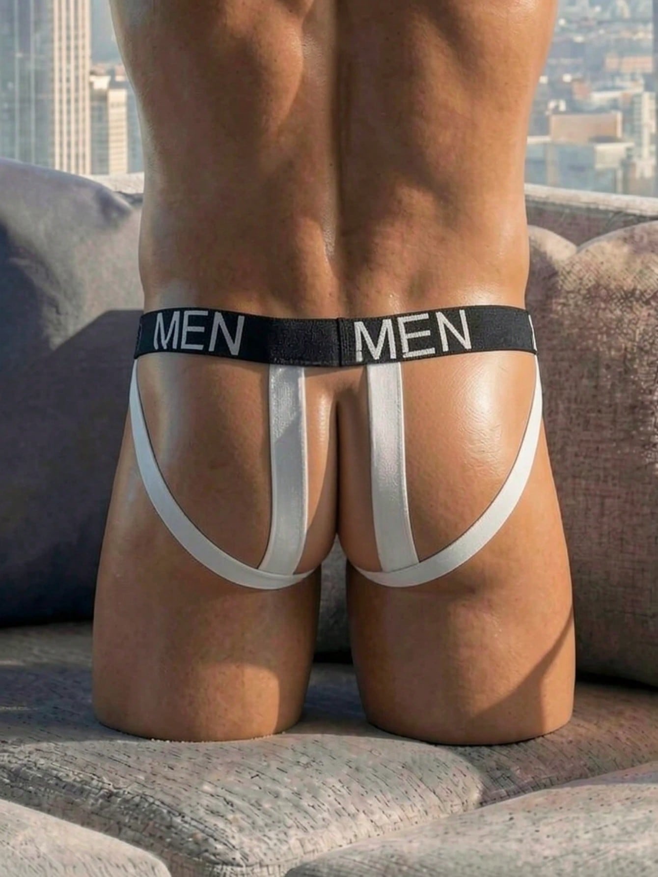 Men's black low-rise jockstrap briefs made from striped mesh fabric with a slim fit design