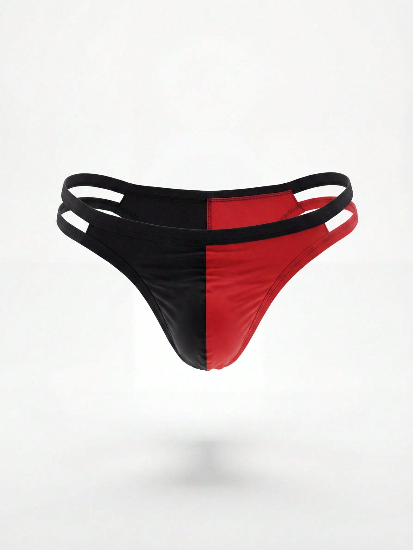 Men's low-rise thong underwear with patchwork styling and contrast binding in knitted fabric