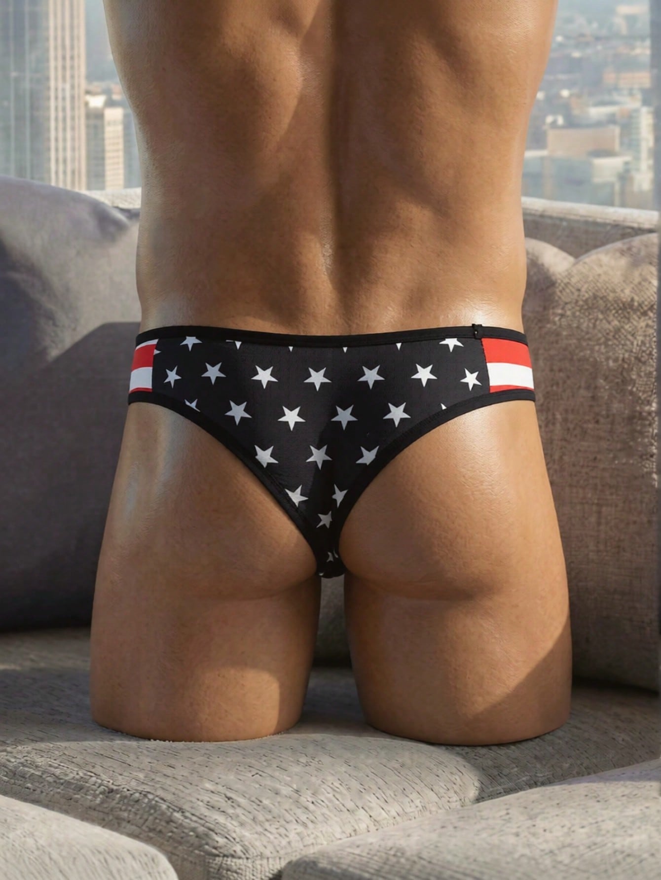 Men's black low-rise thong underwear with geometric striped star print, high-stretch knitted fabric, non-sheer design