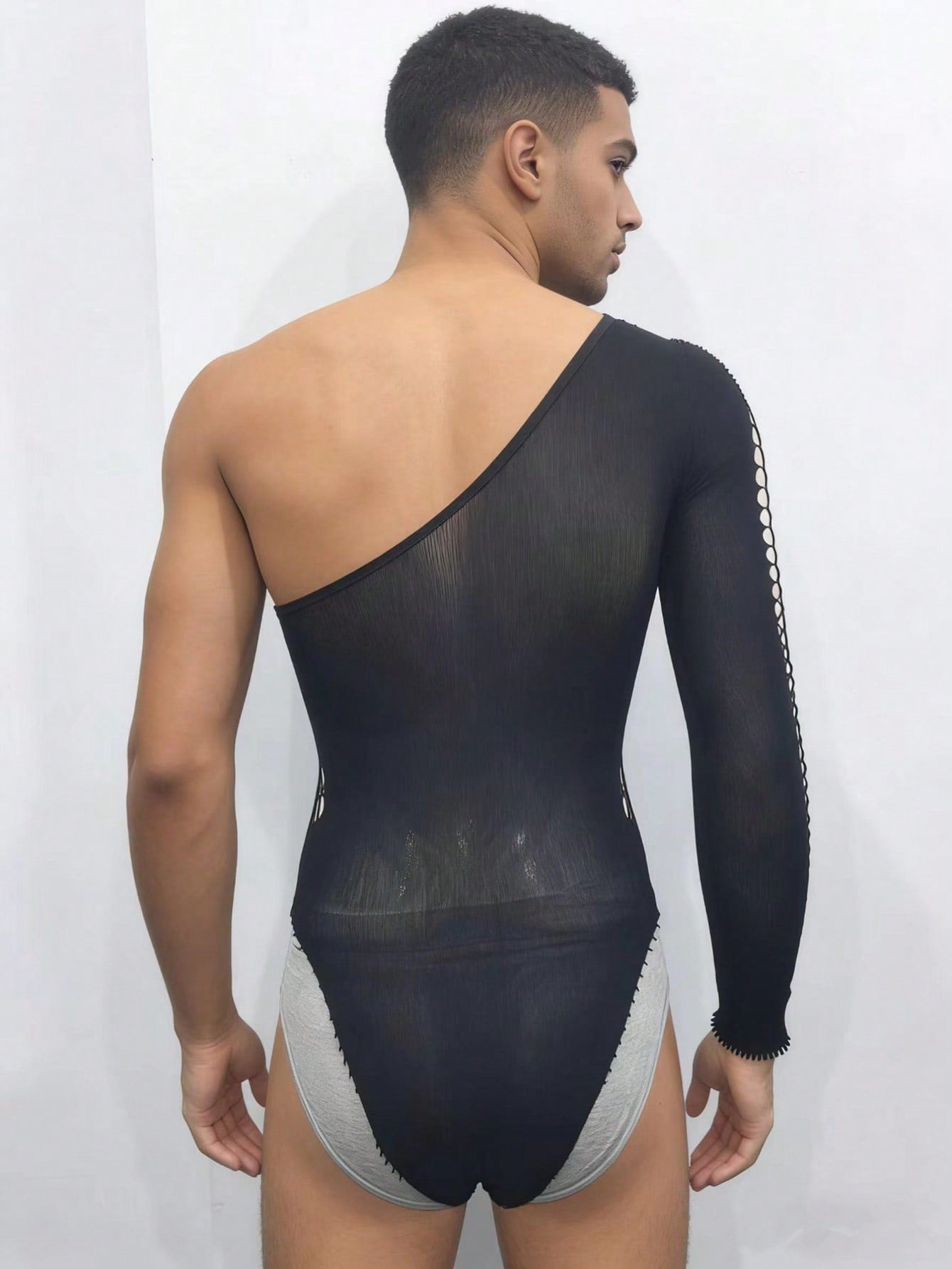 Men's black sheer fishnet jumpsuit with hollow out knit mesh design and thong style