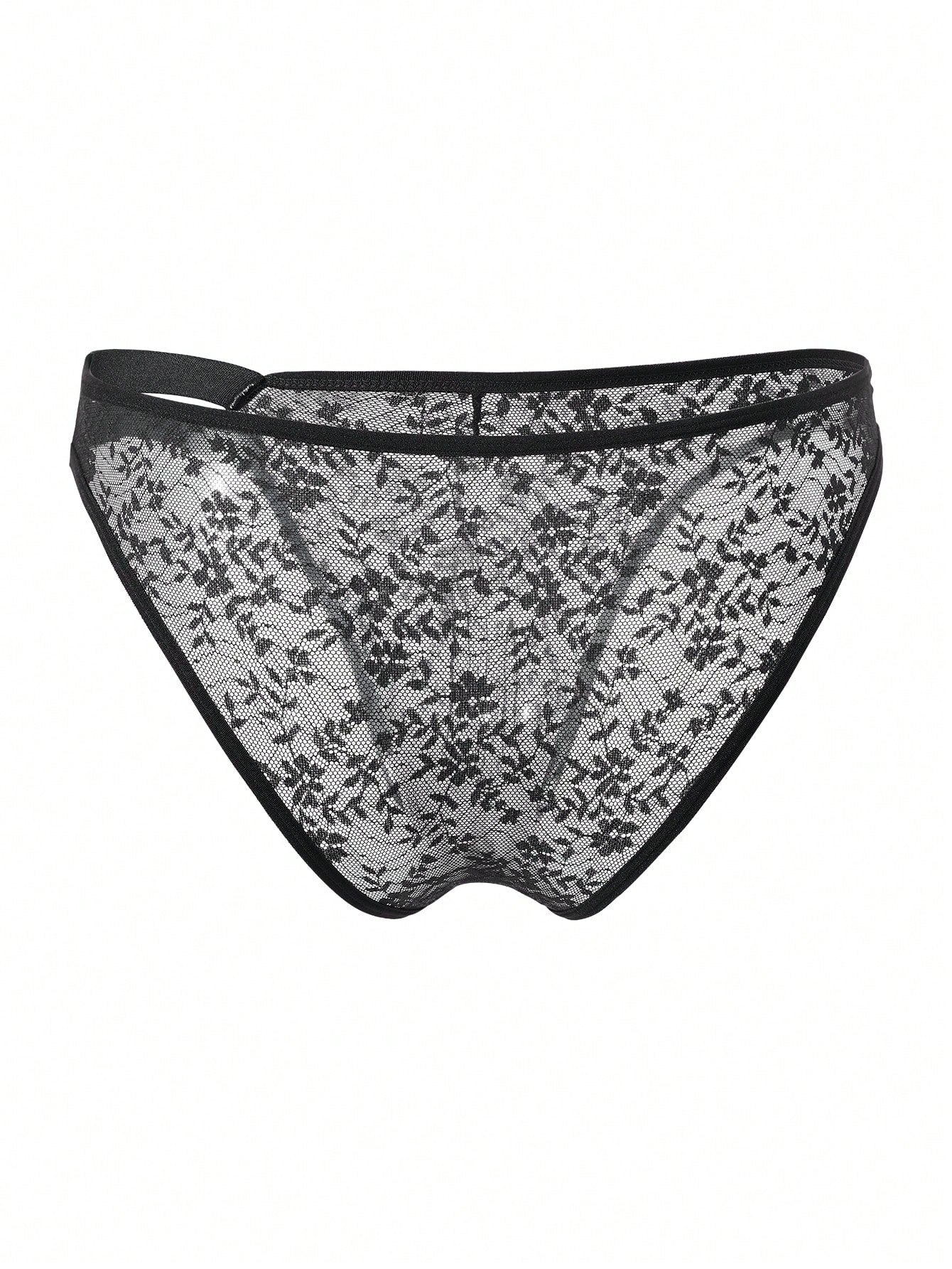 Men's black semi-sheer lace low-rise thong briefs with colorblock styling