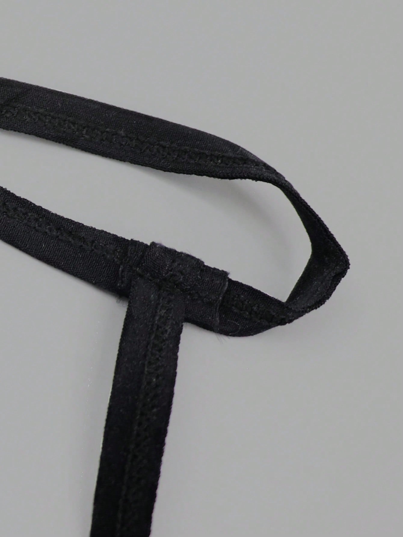 Men's low-rise mesh thong underwear with contrast lace waist, contrast binding, and colorblock design