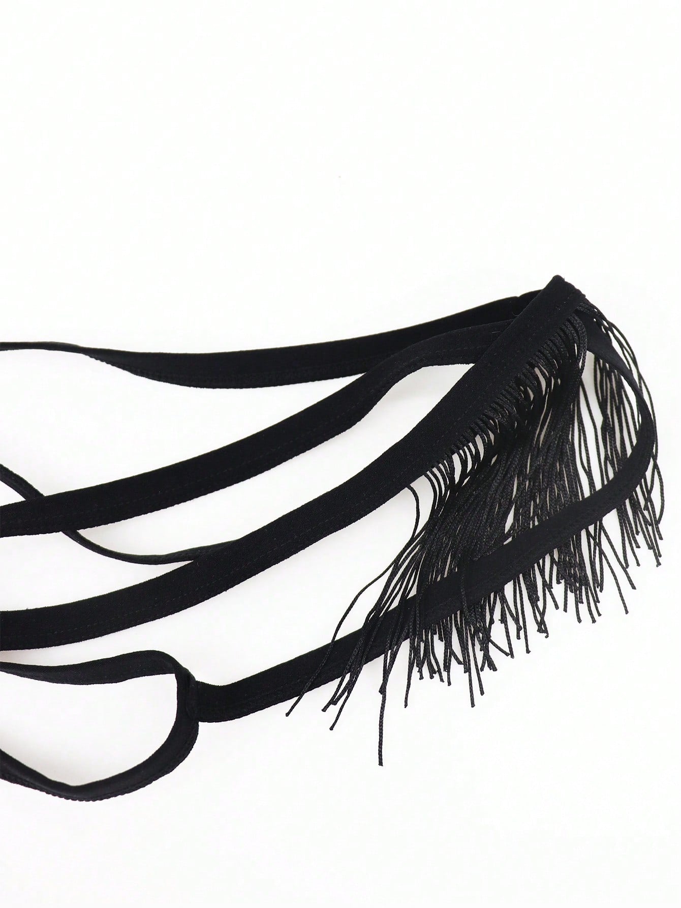 Men's black low-rise thong underwear with fringe detail, plain knitted fabric, and a non-sheer finish