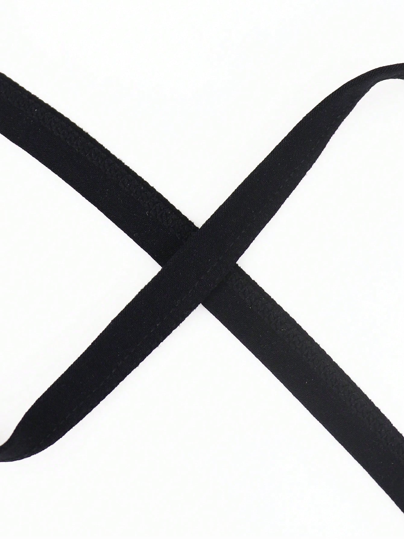 Men's black mid-rise thong underwear with fringe detail, plain design, and medium-stretch knitted fabric.