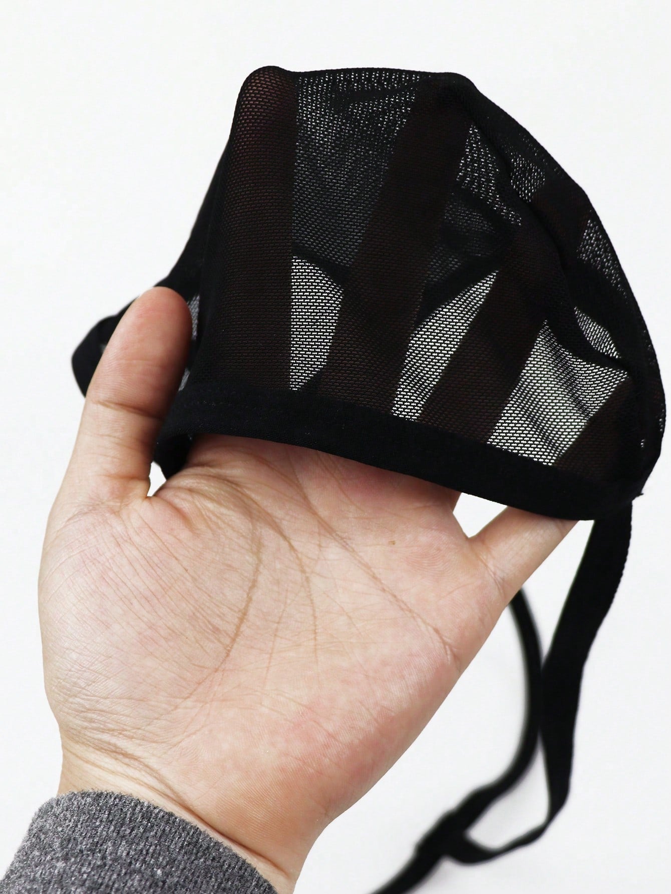 Men's black colorblock mesh mid-rise thong underwear with a non-sheer design