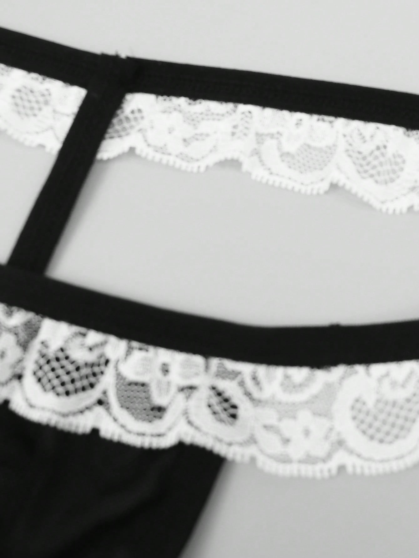 Men's black and white colorblock mid-rise thong made from mesh fabric with lace detailing
