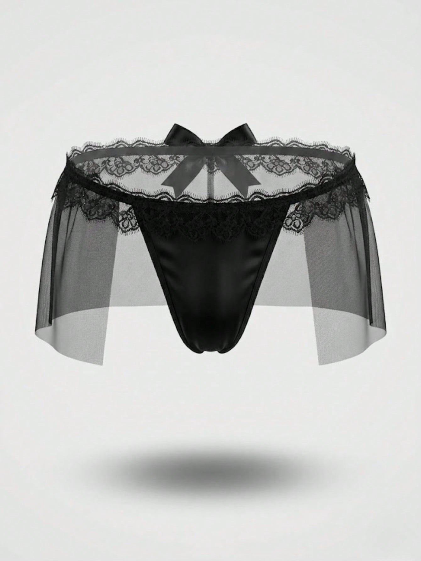 Men's black low-rise thong underwear with lace mesh styling, contrast lace, and bow detail