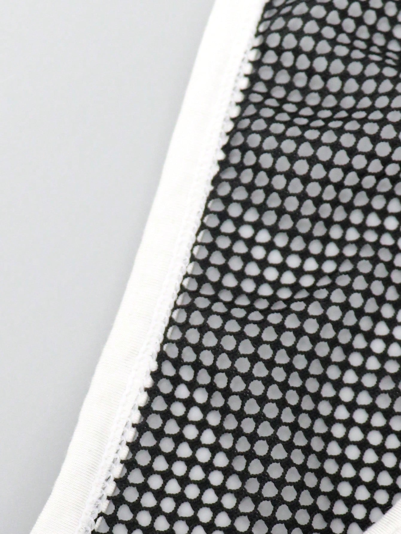 Men's contrast letter print mesh briefs with low-rise cut, tape detail, and contrast binding