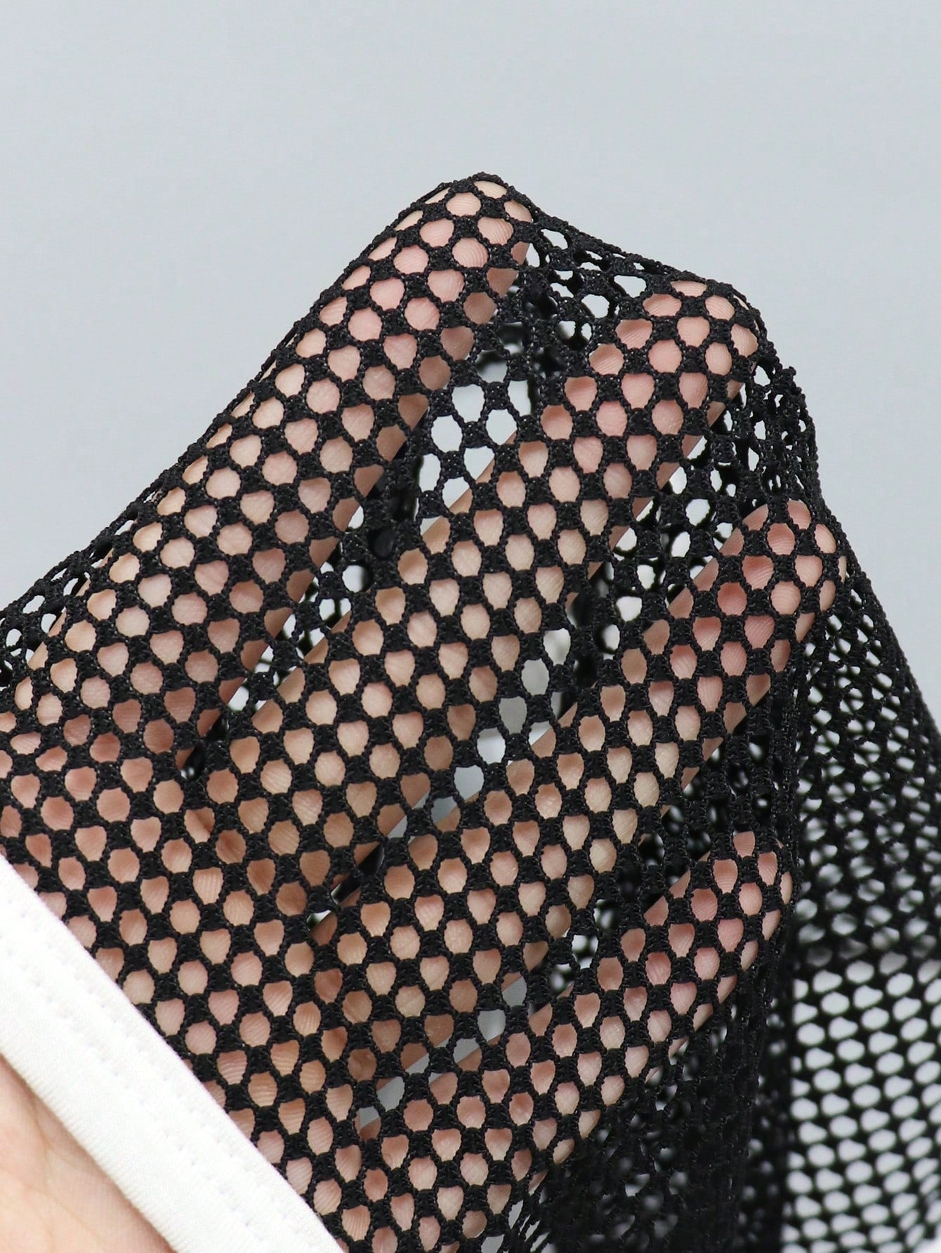 Men's contrast letter print mesh briefs with low-rise cut, tape detail, and contrast binding