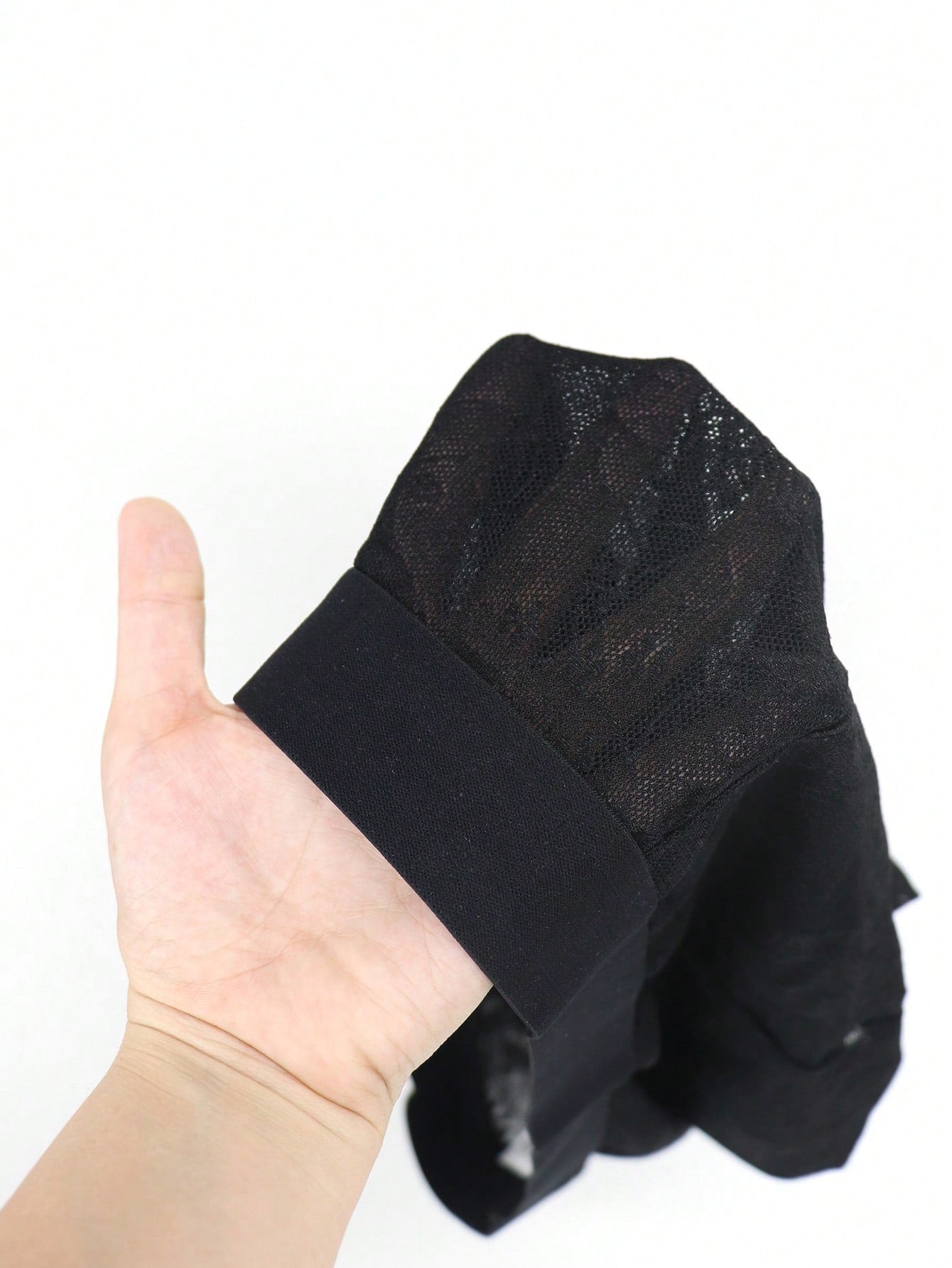 Men's black low-rise mesh boxer shorts with contrast lace details and a plain design