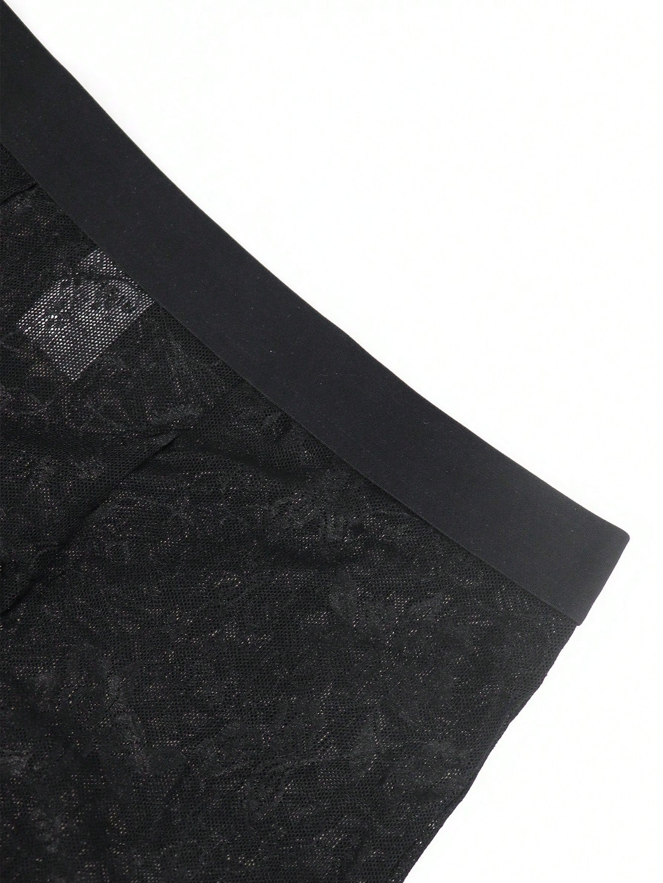 Men's black low-rise mesh boxer shorts with contrast lace details and a plain design