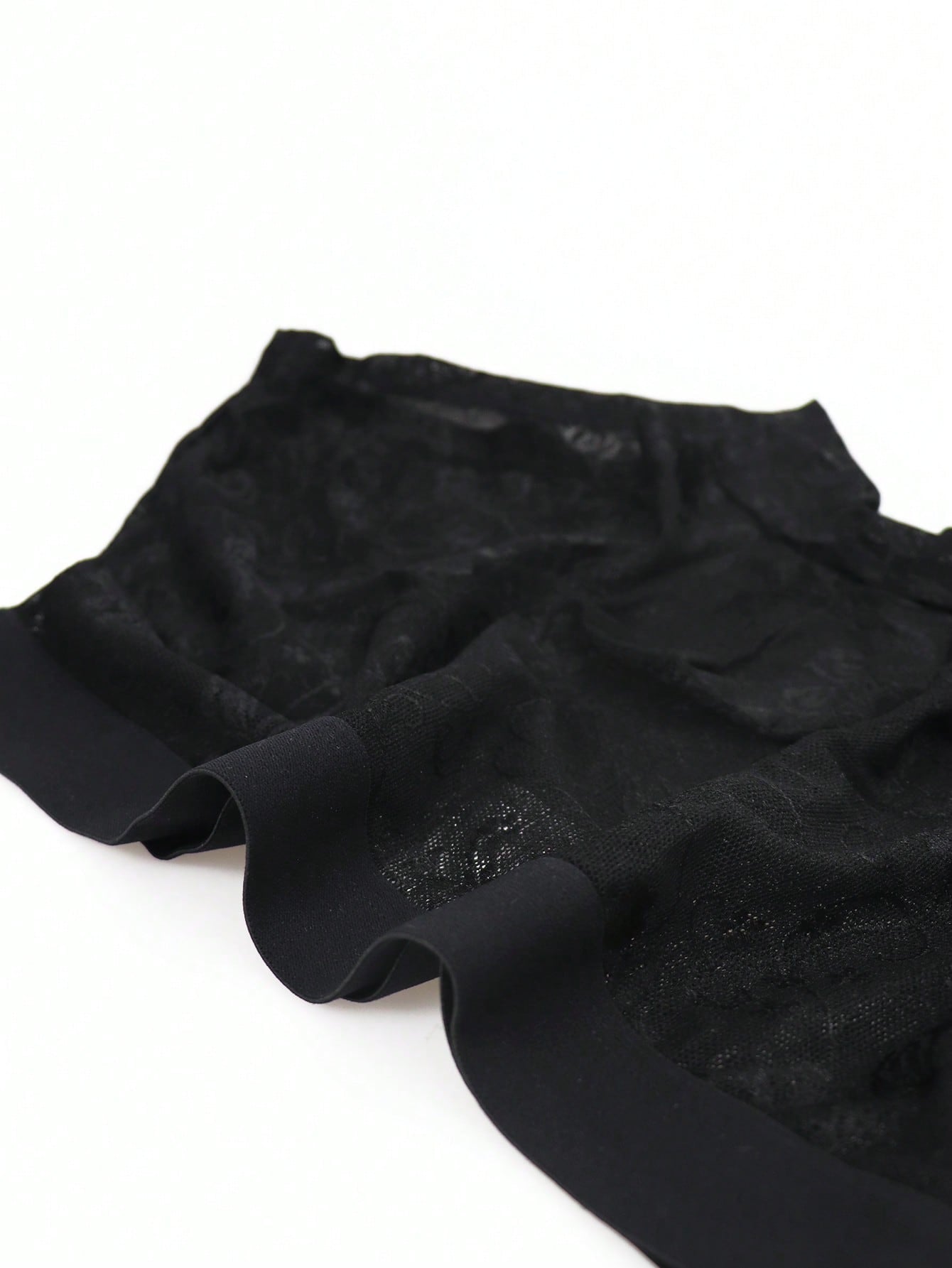 Men's black low-rise mesh boxer shorts with contrast lace details and a plain design