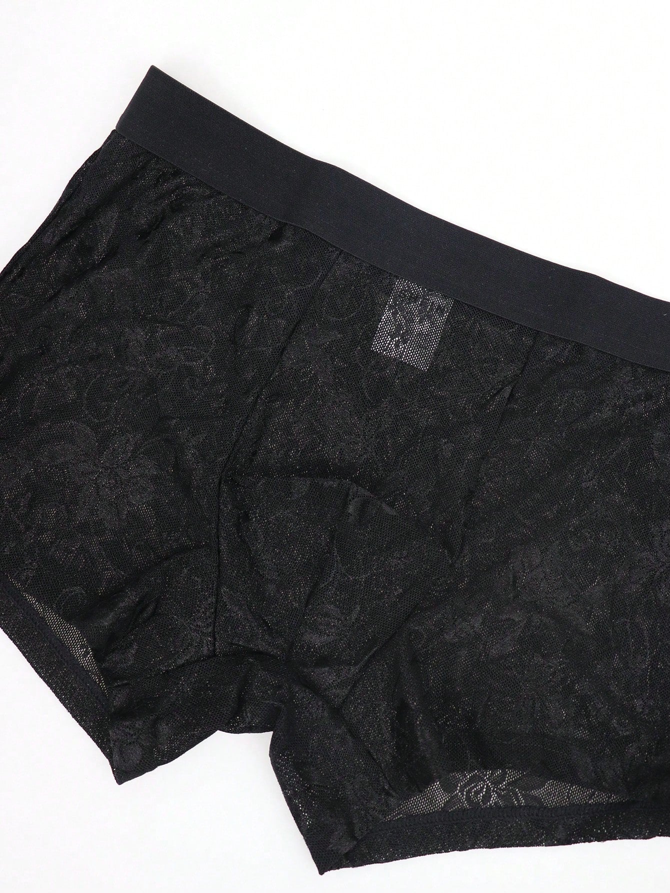 Men's black low-rise mesh boxer shorts with contrast lace details and a plain design