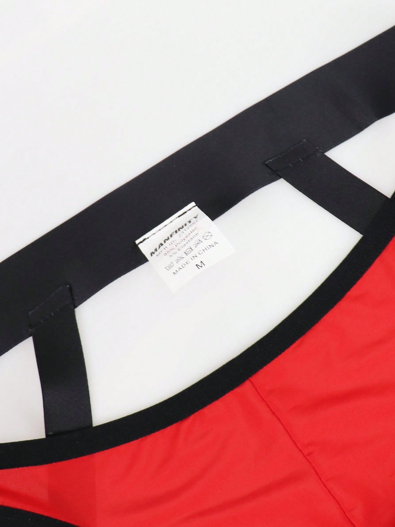Men's solid color hollow breathable jockstrap underwear with a low-rise brief-style front and minimalist design