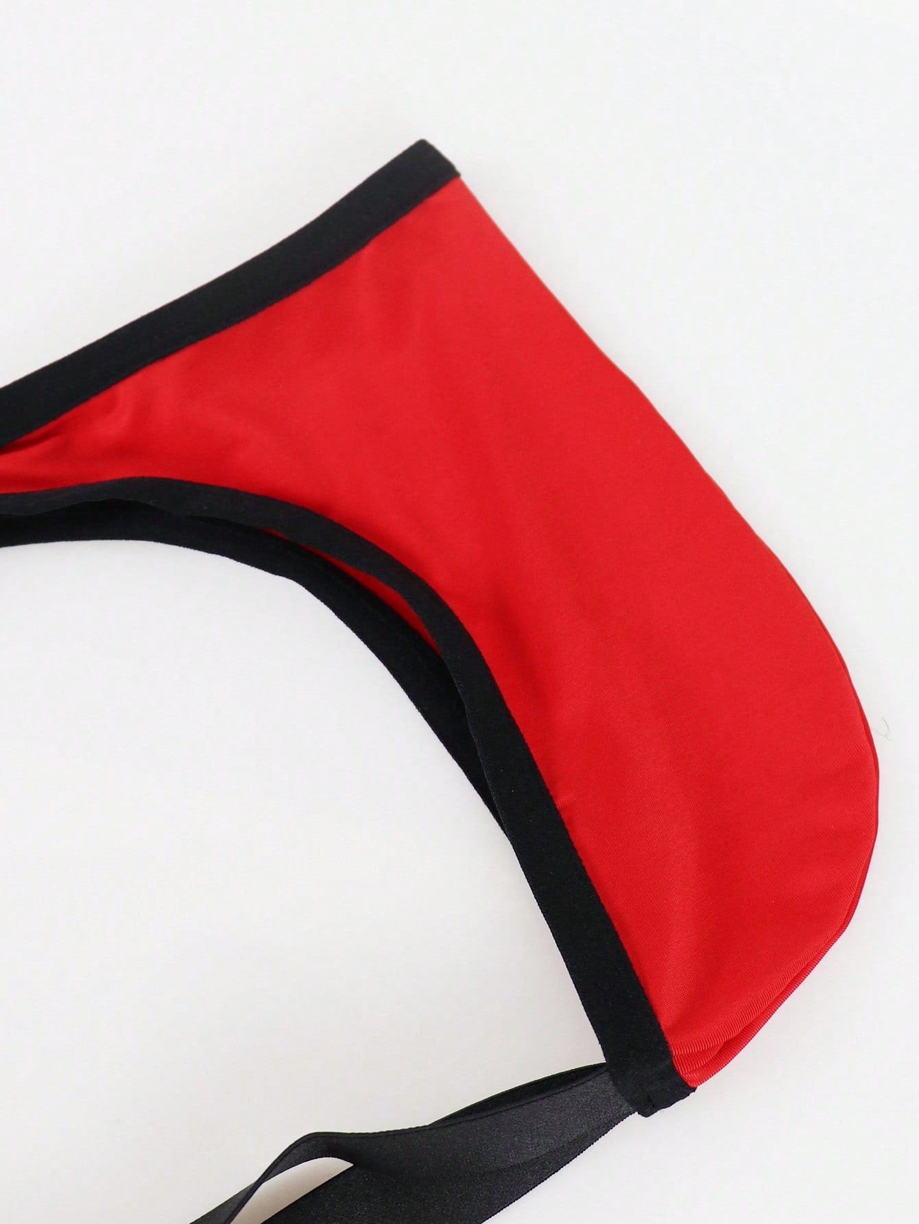 Men's solid color hollow breathable jockstrap underwear with a low-rise brief-style front and minimalist design