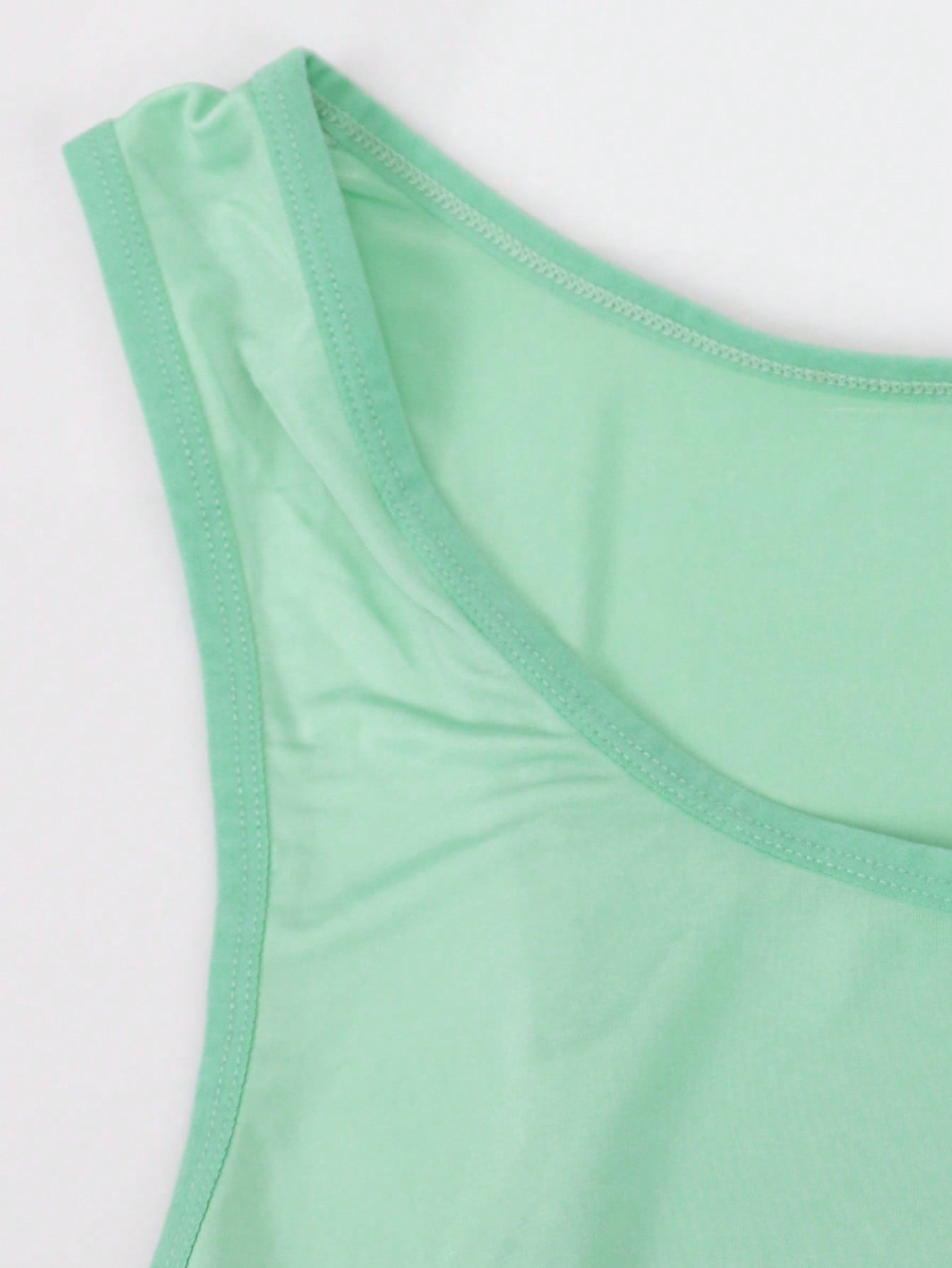 Men's sleeveless shapewear bodysuit with scoop neck, short length, and plain sporty design for medium waist support