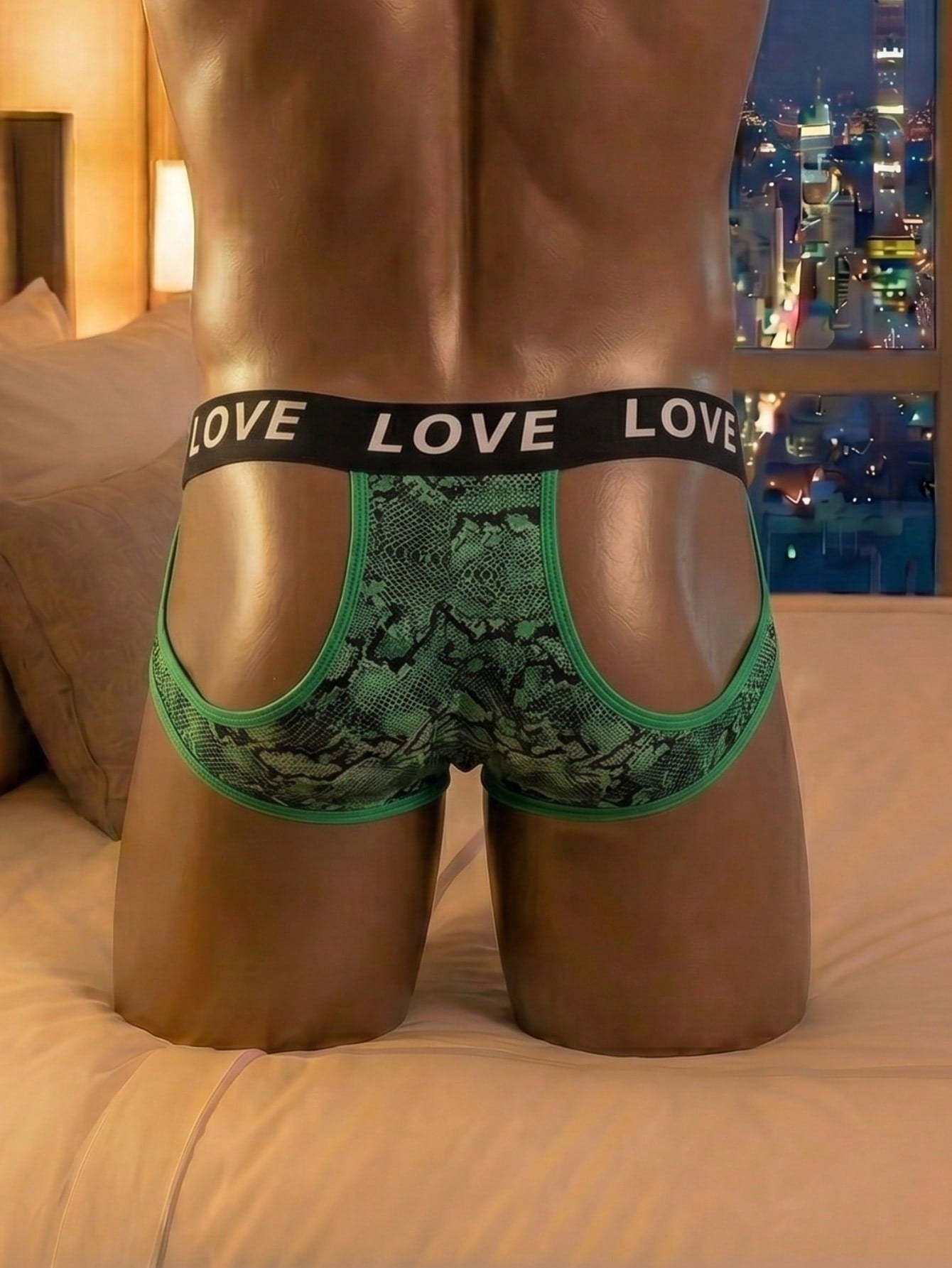 Men's letter print low-rise thong underwear with cut-out detail in a multicolor design.