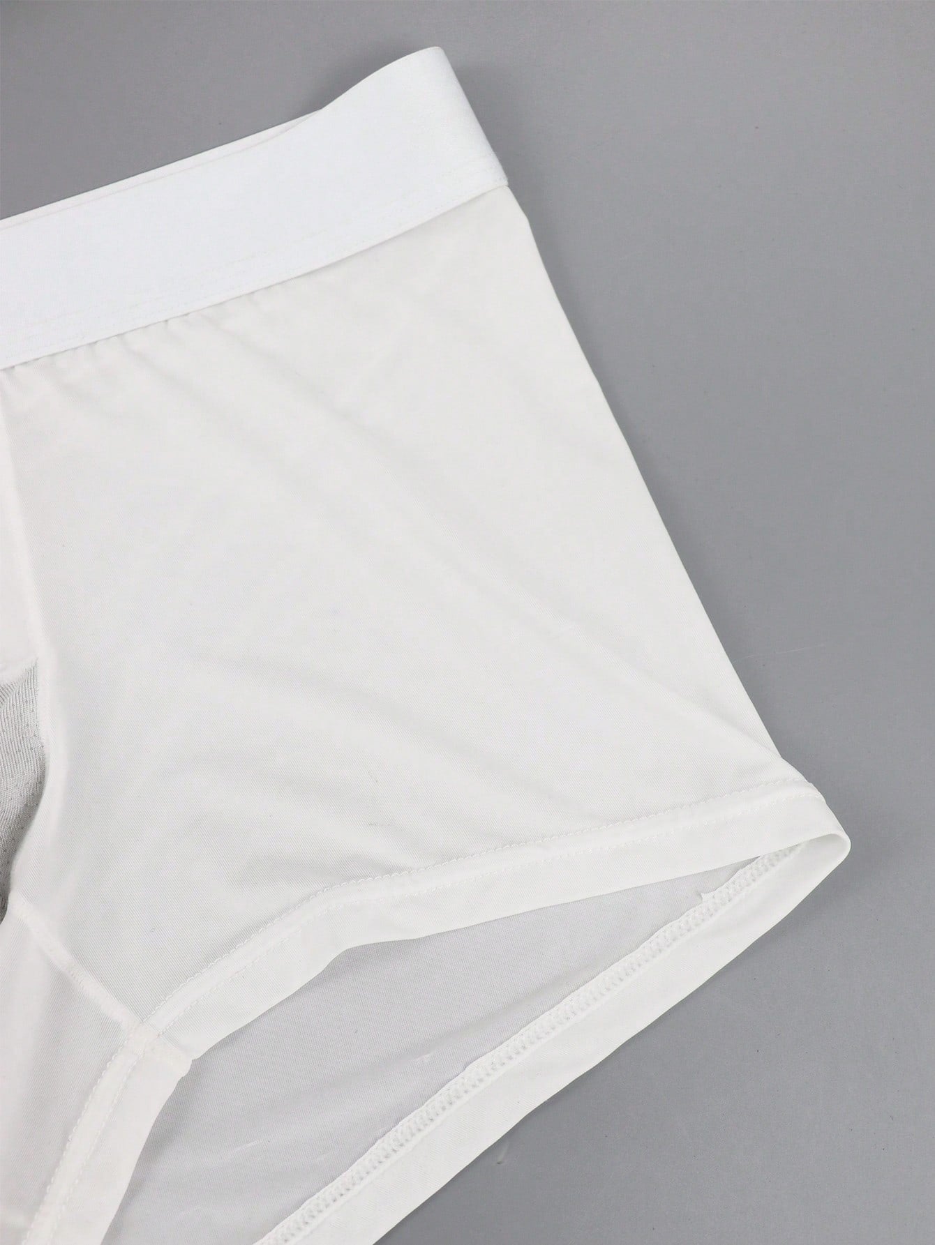 Men's patchwork casual low-rise boxer shorts in a plain style with medium-stretch knitted fabric.