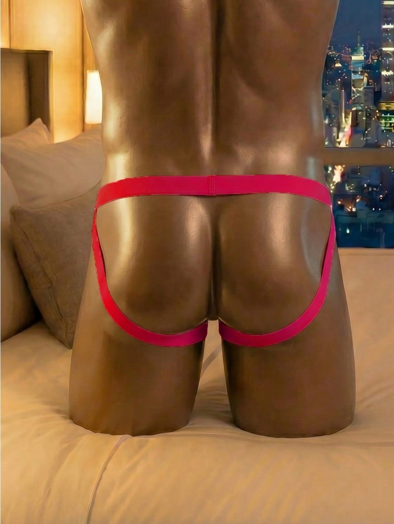 Men's hot pink crotchless low-rise jockstrap underwear with criss cross detail and plain knitted fabric