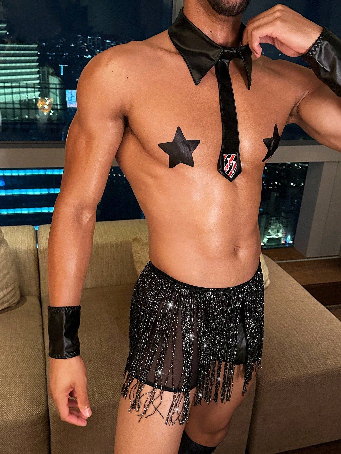 Men's black costume set with letter embroidered tie, neck collar, gloves, tassel waist belt and sheer shorts