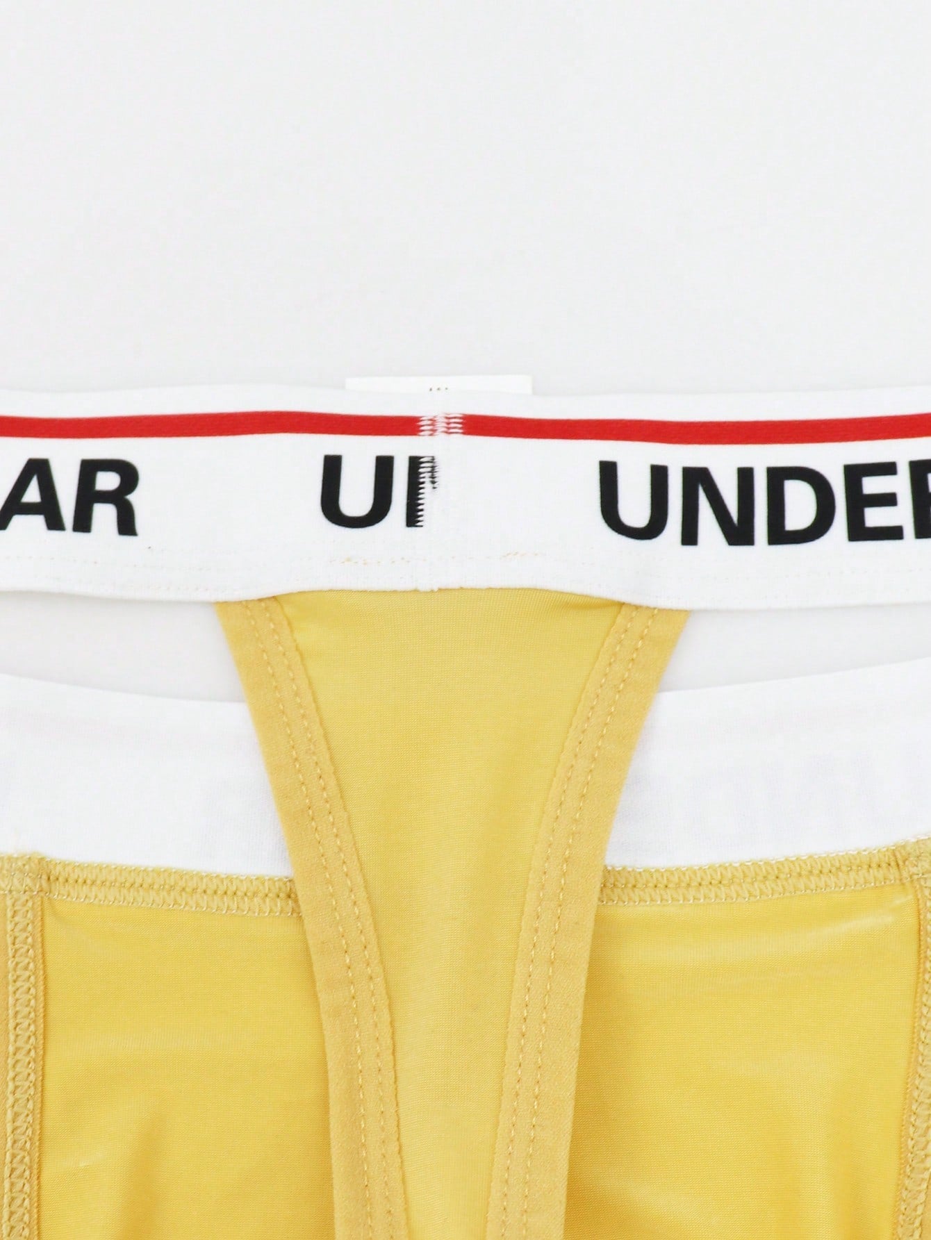 Men's low-rise thong briefs with letter waistband trim and rhinestone detail