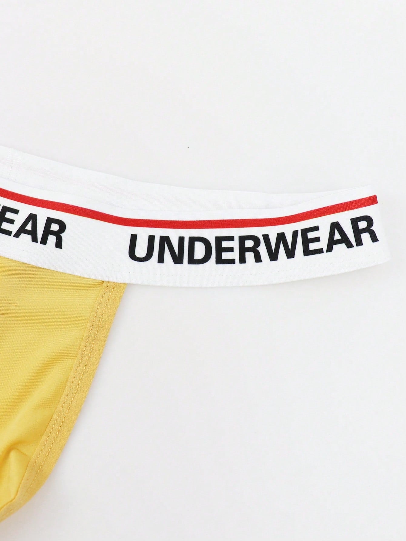Men's low-rise thong briefs with letter waistband trim and rhinestone detail