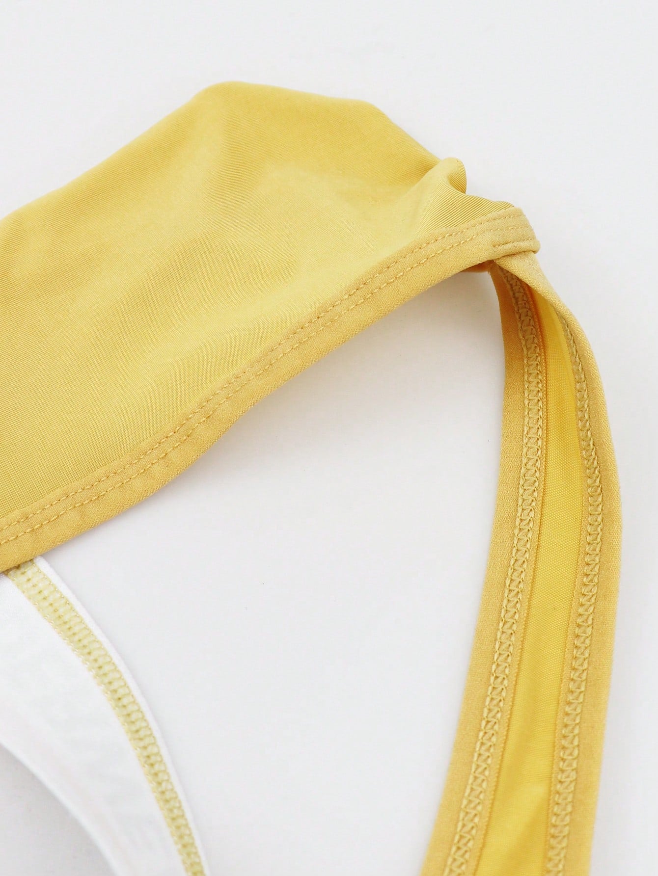 Men's low-rise thong briefs with letter waistband trim and rhinestone detail