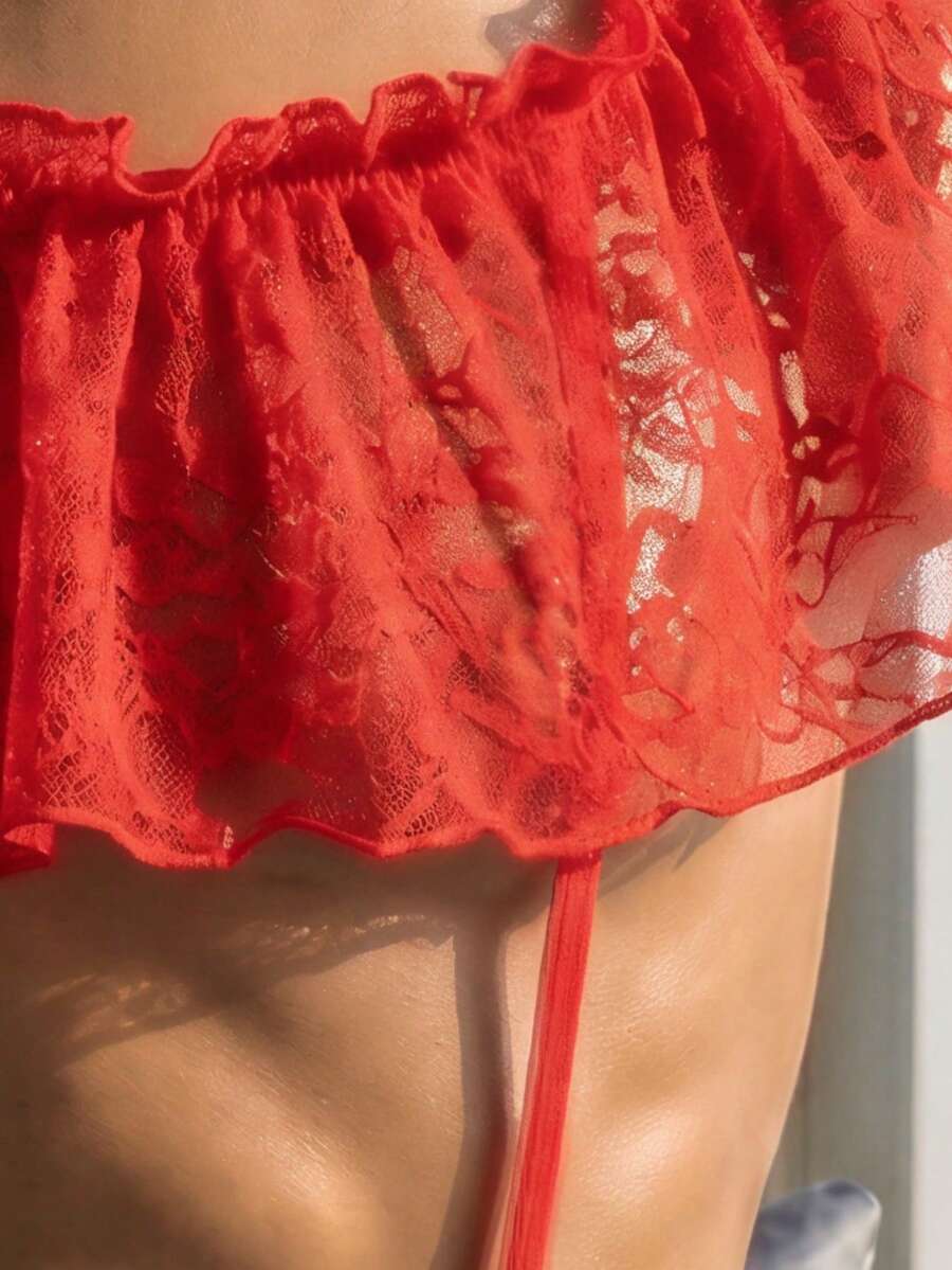 Red backless men's sexy lingerie jumpsuit with ruffle hem and floral pattern for club outfits and music festivals.