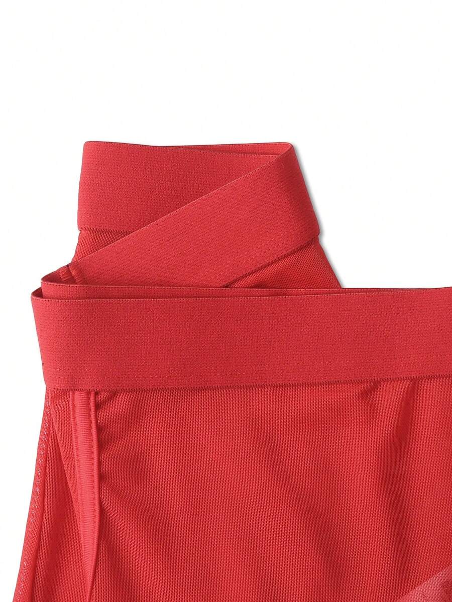 Men's solid red sheer mesh boxer shorts underwear with mid-rise waist.