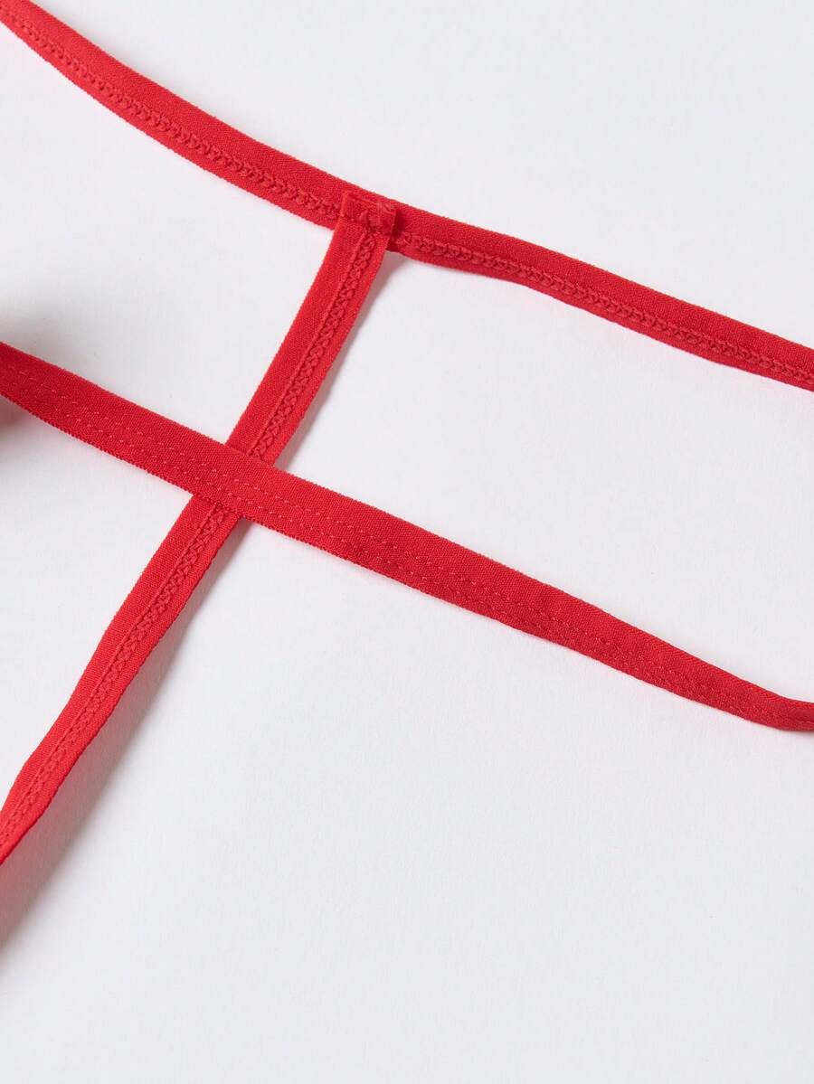 Men's red colorblock low-rise thong underwear made from medium-stretch knitted fabric.