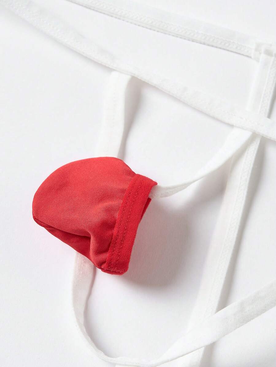 Front view of men's red and white low-rise thong underwear featuring a plain pattern and knitted stretch fabric.