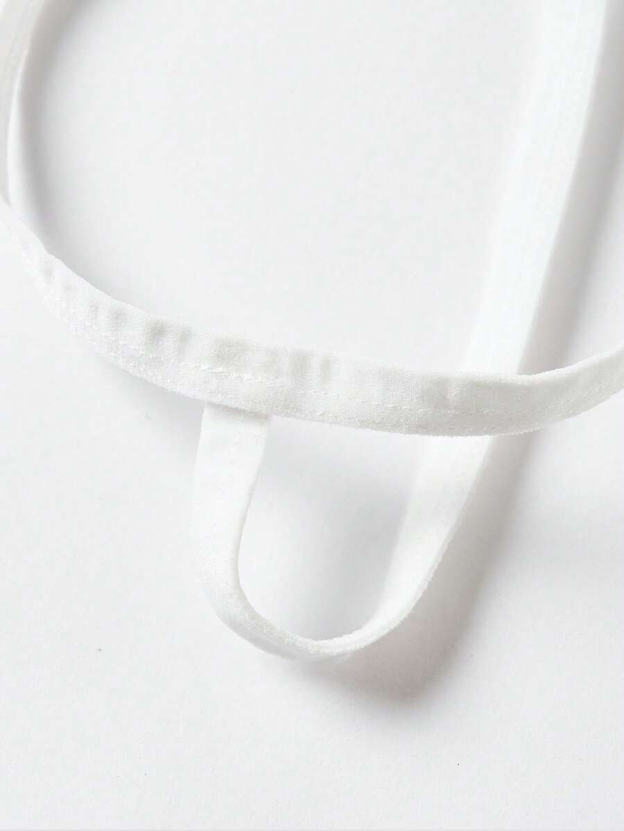 Front view of men's red and white low-rise thong underwear featuring a plain pattern and knitted stretch fabric.
